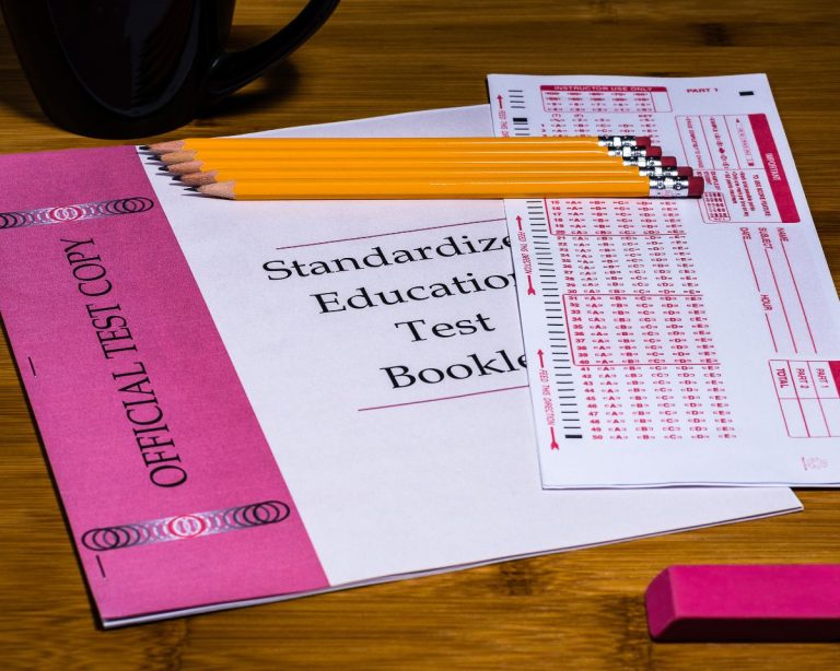 Photo of a standardized test booklet answer sheet and sharpened pencils