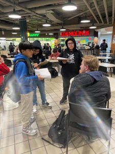 Compass Academy sixth-graders interviewing a commuter at Union Station.