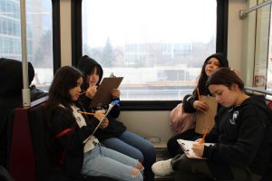 Four Compass Academy sixth-grade girls aboard an RTD light rail train