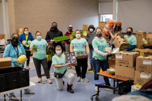 Volunteers preparing food for KIPP Colorado's No Cost Grocery Program.